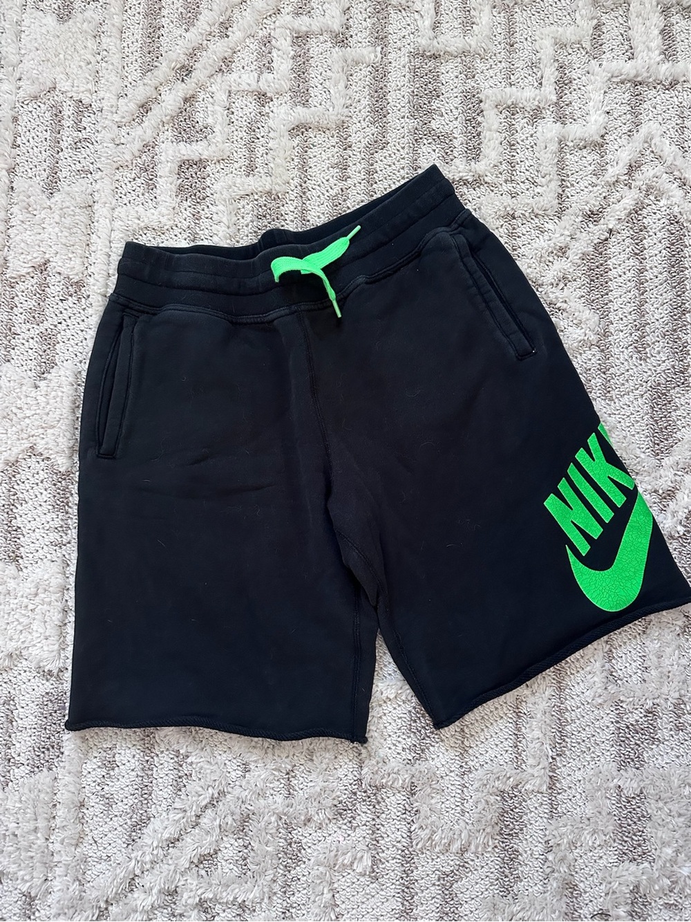 Nike Black Athletic Shorts with Neon Green Logo and Drawcord